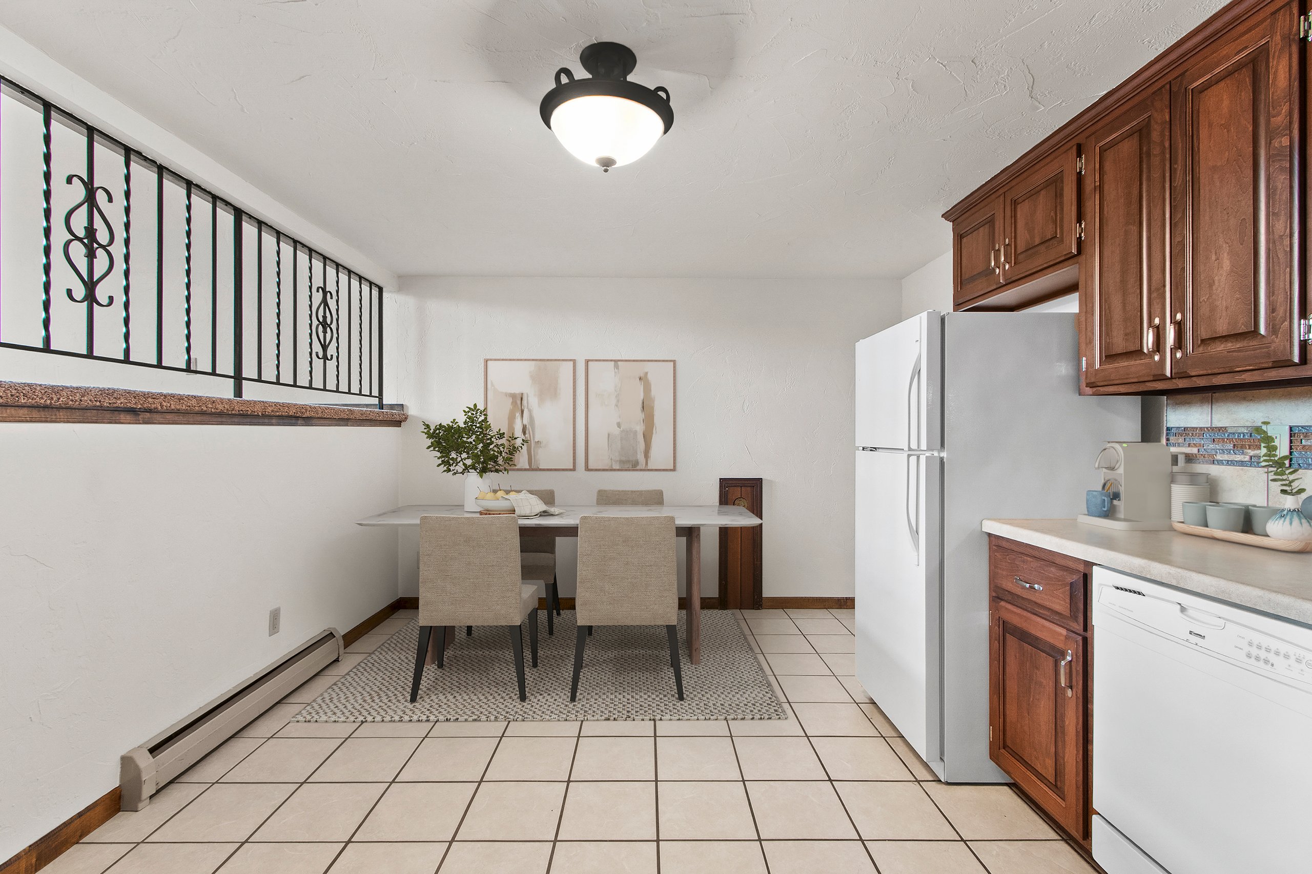 Virtually staged kitchen and dining area in a representative apartment